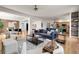 Open-concept living room showcasing a modern interior design and hardwood floors at 3406 Purcell St, Brighton, CO 80601