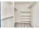 Spacious walk-in closet with ample shelving and carpeting, providing plenty of storage at 3406 Purcell St, Brighton, CO 80601
