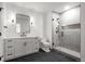 Modern bathroom featuring a vanity, toilet, and frameless glass shower with tiled walls at 5 Churchill Dr, Cherry Hills Village, CO 80113