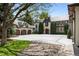 Elegant home featuring a circular driveway, three-car garage, and mature trees at 5 Churchill Dr, Cherry Hills Village, CO 80113