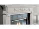 Close-up of a fireplace with a marble mantel and decorative embellishments at 5 Churchill Dr, Cherry Hills Village, CO 80113