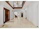 Grand foyer with high ceilings, marble floors, and a striking staircase at 5 Churchill Dr, Cherry Hills Village, CO 80113