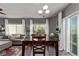 Open-concept dining area bathed in natural light, connecting seamlessly to the living area at 23757 Eagle Bend Ln, Parker, CO 80138