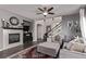 Open-concept living area featuring a fireplace, comfortable seating, and elegant decor at 23757 Eagle Bend Ln, Parker, CO 80138