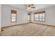 Bright bedroom with carpet and large windows at 14199 County Road 26, Fort Lupton, CO 80621