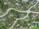 Aerial view of the community showcasing its mountain scenery and wooded landscape at 28833 Western Dr, Evergreen, CO 80439