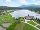 Scenic aerial shot of Evergreen Lake and surrounding properties at 28833 Western Dr, Evergreen, CO 80439