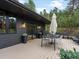 Spacious outdoor deck with a dining area and stylish accents at 28833 Western Dr, Evergreen, CO 80439