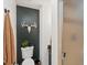 Modern bathroom with a glass shower and black accent wall at 28833 Western Dr, Evergreen, CO 80439
