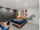 Stylish bedroom featuring a blue quilt, modern decor, and a large built-in closet at 28833 Western Dr, Evergreen, CO 80439