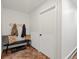 Entryway with tile floors, bench, and coat rack at 28833 Western Dr, Evergreen, CO 80439