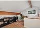 This loft space features a built-in bookcase with wood accents and a window at 28833 Western Dr, Evergreen, CO 80439