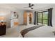 Relaxing bedroom with an infrared sauna and sliding glass doors to the deck with natural views at 28833 Western Dr, Evergreen, CO 80439
