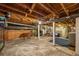 Spacious unfinished basement with exposed beams, utility connections and storage space at 3002 Quitman St, Denver, CO 80212