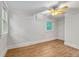 Bright bedroom features hardwood floors, a ceiling fan and white trim at 3002 Quitman St, Denver, CO 80212