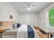 Bright bedroom with a ceiling fan, a window, and neutral decor at 3002 Quitman St, Denver, CO 80212