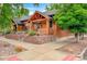 Charming brick home with a well-maintained front yard and raised garden beds at 3002 Quitman St, Denver, CO 80212