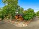 Charming brick home with mature trees and a well-maintained yard at 3002 Quitman St, Denver, CO 80212