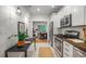 Modern kitchen with stainless steel appliances and a view of the dining room at 3002 Quitman St, Denver, CO 80212