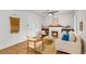 Bright living room with a fireplace, ceiling fan, and hardwood floors at 3002 Quitman St, Denver, CO 80212