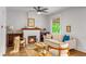 Cozy living area with a fireplace, comfortable seating, and natural light at 3002 Quitman St, Denver, CO 80212