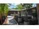 Picturesque backyard showcasing a dining area and fire pit with comfortable seating arrangements at 1830 S Fillmore St, Denver, CO 80210
