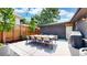 Outdoor dining area with modern furniture and a peaceful ambiance at 1830 S Fillmore St, Denver, CO 80210
