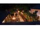 Aerial view of a cozy backyard featuring string lights, a fire pit, patio furniture, and landscaping at 1830 S Fillmore St, Denver, CO 80210