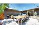 Modern backyard patio with sleek brick exterior, comfortable seating, and a spacious area for entertaining guests at 1830 S Fillmore St, Denver, CO 80210
