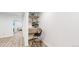 Small basement office area features a small desk, chair, and recessed lighting at 1830 S Fillmore St, Denver, CO 80210