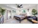 Bright bedroom with a ceiling fan, modern decor, and neutral color palette, creating a peaceful retreat at 1830 S Fillmore St, Denver, CO 80210