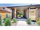 Inviting covered front porch with seating, modern brick, and stylish address display at 1830 S Fillmore St, Denver, CO 80210