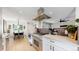 Kitchen featuring stainless steel appliances, gas cooktop, and open layout with views to living and dining at 1830 S Fillmore St, Denver, CO 80210