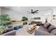 Comfortable living room with a modern fireplace, stylish furniture, and bright natural light at 1830 S Fillmore St, Denver, CO 80210