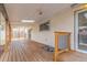 Back porch features a wooden deck, covered ceiling, and access to a fenced yard at 6052 Taft St, Arvada, CO 80004