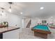Basement features a billiards table, kitchenette, and living area at 6052 Taft St, Arvada, CO 80004