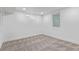 Spacious basement features carpeted flooring, neutral paint and natural light from small windows at 6052 Taft St, Arvada, CO 80004