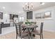 Dining room with a round table and seating for four, adjacent to the modern kitchen at 6052 Taft St, Arvada, CO 80004
