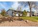 The exterior of this cozy ranch-style home offers a private drive, mature landscaping, and neutral exterior colors at 6052 Taft St, Arvada, CO 80004