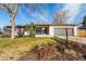 Charming ranch-style home with a well-manicured front yard and attached garage at 6052 Taft St, Arvada, CO 80004