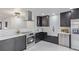 Modern kitchen featuring stainless steel appliances, white countertops, and subway tile backsplash at 6052 Taft St, Arvada, CO 80004