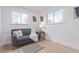 Bright living room with hardwood floors, modern furniture, natural light, and neutral decor at 6052 Taft St, Arvada, CO 80004