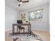 Bright office features a large window, wood floors, neutral paint and plenty of natural light at 6052 Taft St, Arvada, CO 80004