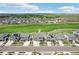 Street-level aerial of the houses with expansive golf course and green space at 16595 E 110Th Ave, Commerce City, CO 80022