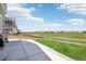 Expansive backyard and patio space offering golf course views at 16595 E 110Th Ave, Commerce City, CO 80022