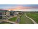 Expansive backyard with manicured lawn, patios, and views of the surrounding neighborhood at 16595 E 110Th Ave, Commerce City, CO 80022