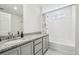Bathroom features granite countertop, single sink and bathtub with shower at 16595 E 110Th Ave, Commerce City, CO 80022