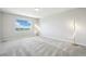Bright bedroom with large window and neutral carpet at 16595 E 110Th Ave, Commerce City, CO 80022
