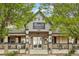 Quaint coffee shop with outdoor seating, framed by lush trees at 16595 E 110Th Ave, Commerce City, CO 80022