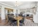 Elegant dining area with a rustic hutch and an adjacent kitchen for easy serving at 16595 E 110Th Ave, Commerce City, CO 80022